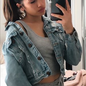 Distressed denim jacket